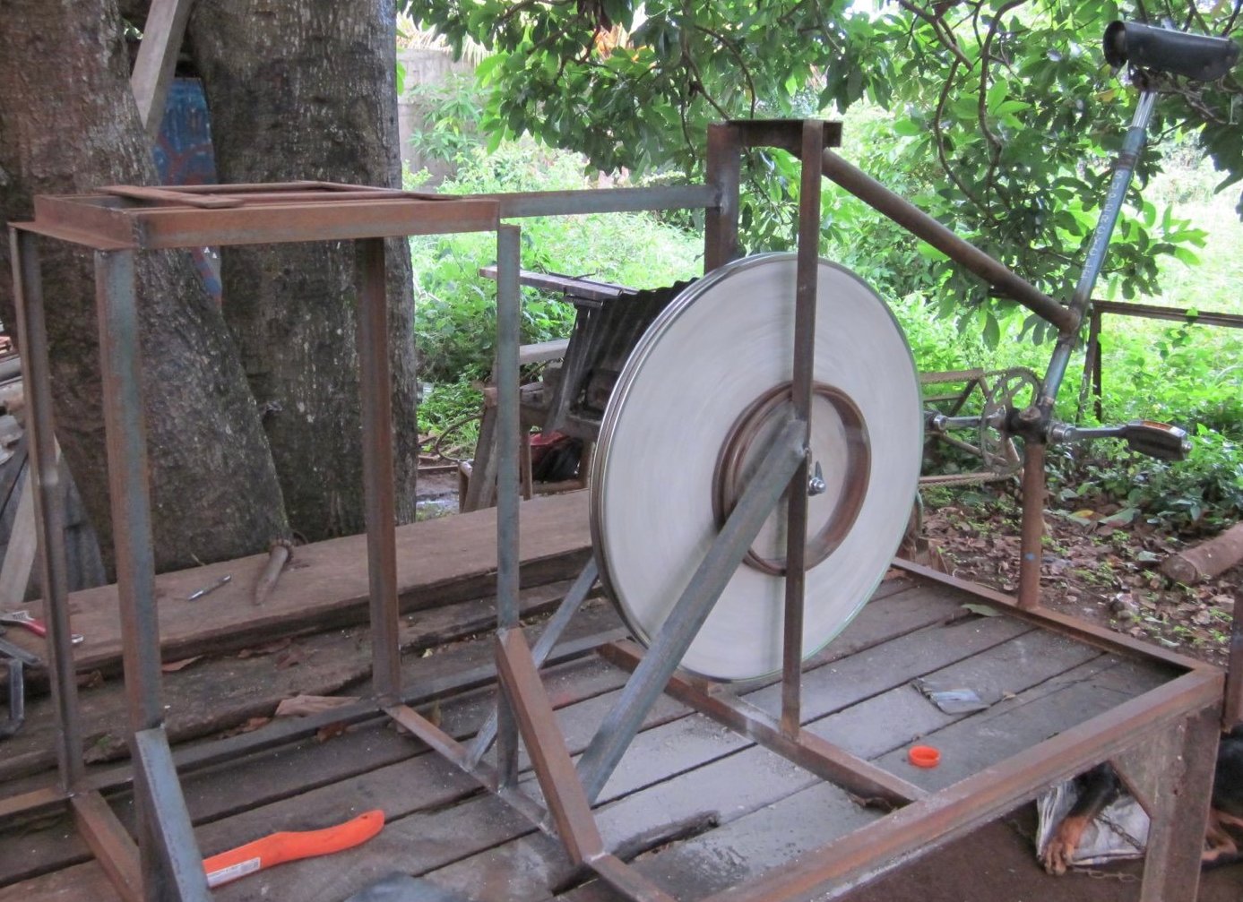 The whole machine is visible on the workbench, but in a partially assembled state.