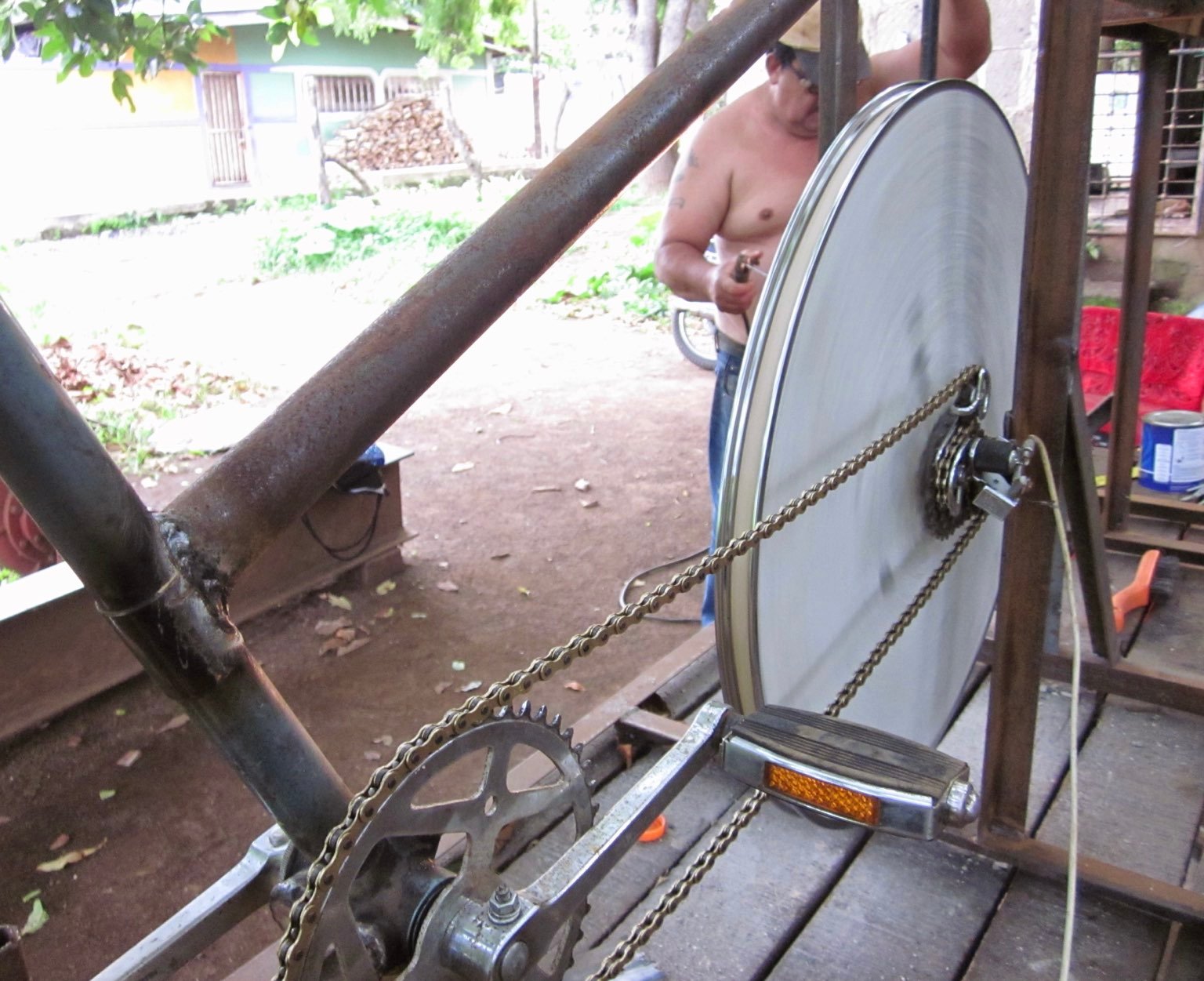 A bike chain connecting the crankset to the flywheel and derailleur.